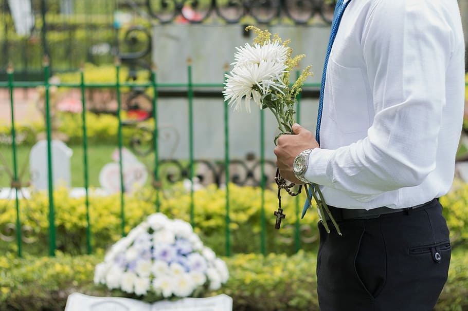 Mourner with flowers - probate searching
